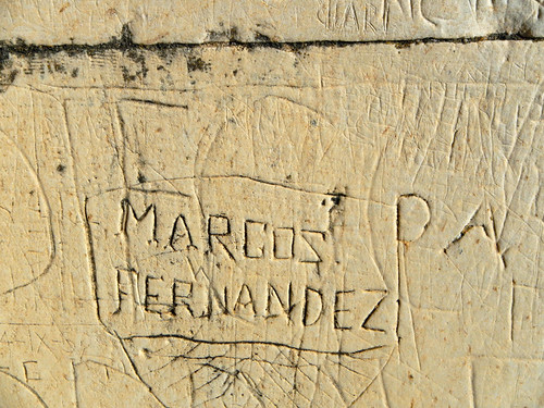 Carved graffiti on Segovia's Castle walls in Spain