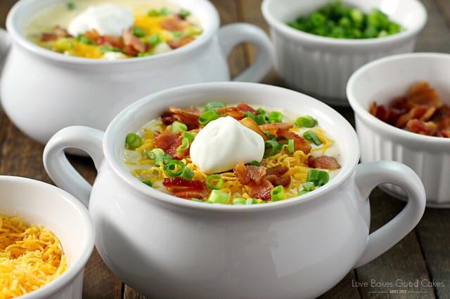 AMAZING!! Loaded Baked Potato Soup in two bowls with toppings.