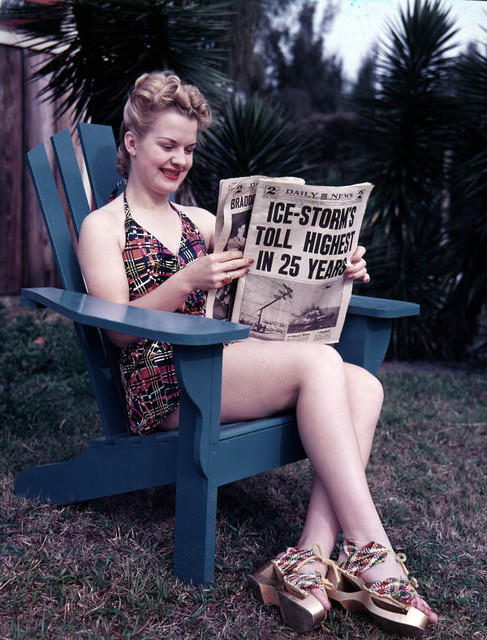 Unidentified woman in Sarasota reading about winter storms up North