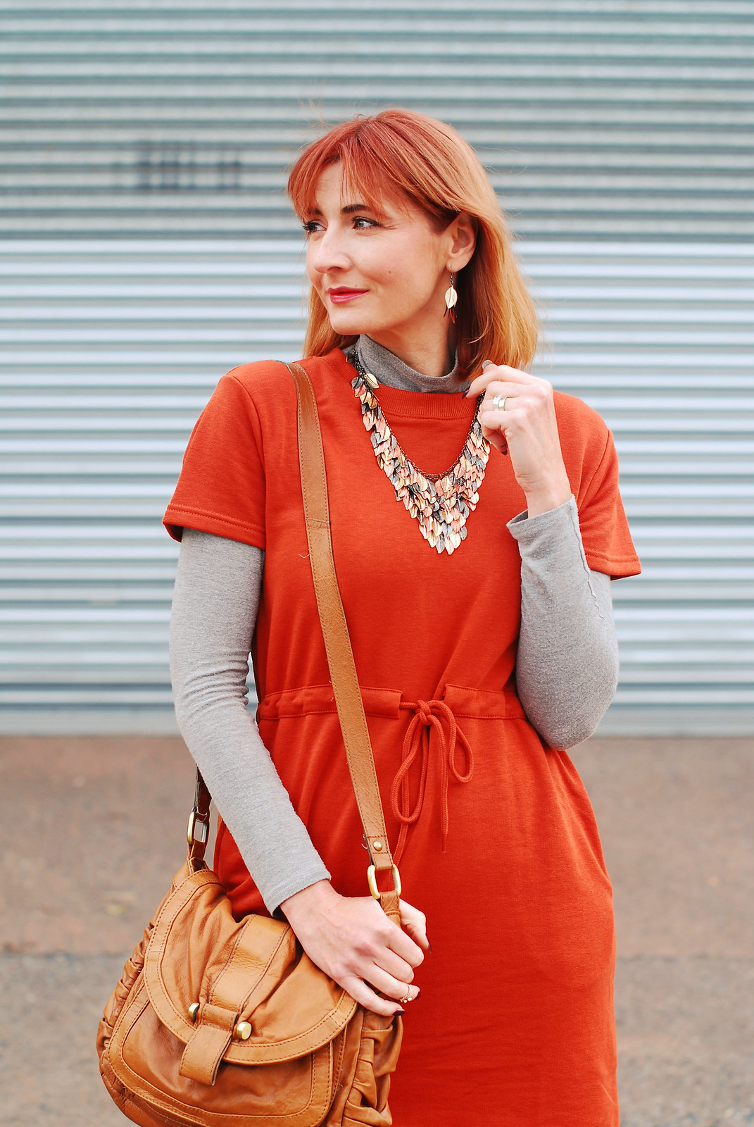 A rust t-shirt dress layered over grey roll neck, khaki floral wide leg pants, autumnal tri-colour leaf necklace | Autumn style | Fall outfit | Layering | Not Dressed As Lamb, over 40 style