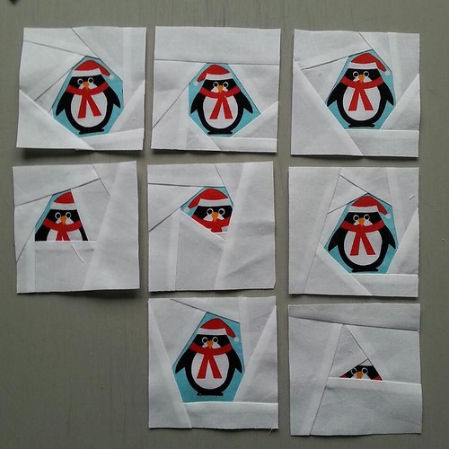 Eight penguins. (Or bits of penguins.) I'm hoping the way I've trimmed them makes them look cute and appealing and deliberately skew-whiff rather than 'they were supposed to all be straight and centred but I had a tipple before picking up the rotary cutte