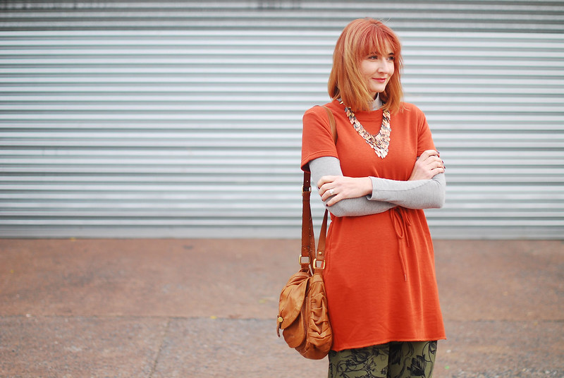 A rust t-shirt dress layered over grey roll neck, khaki floral wide leg pants, autumnal tri-colour leaf necklace | Autumn style | Fall outfit | Layering | Not Dressed As Lamb, over 40 style