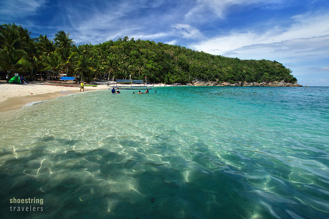 Puting Buhangin Beach viewed from the entrance to Kwebang Lampas