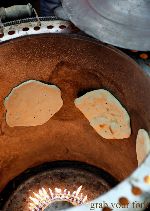 Naan bread cooking in a tandoor oven at the Ramadan food festival in Lakemba Sydney