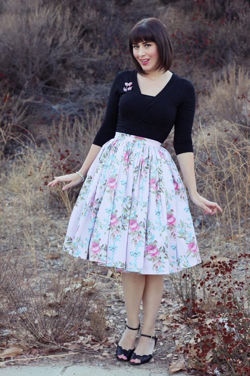 Pinup Girl Clothing Pinup Couture Jenny Skirt in Floral Ribbon Print Heart of Haute Sweet Sweater in Black