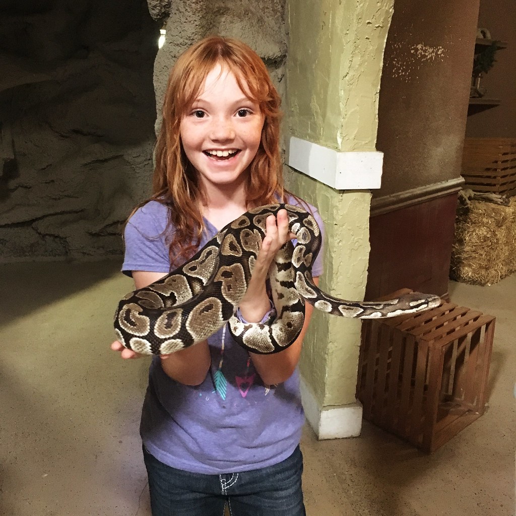 Girl holding snake