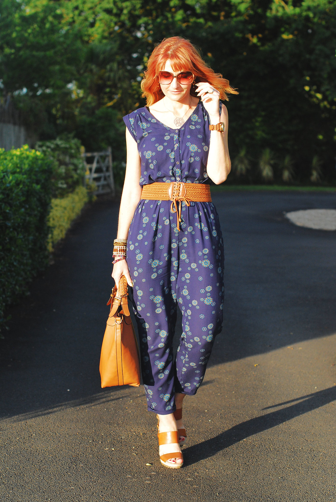 Simple summer styling: Blue floral jumpsuit with tan accessories | Not Dressed As Lamb