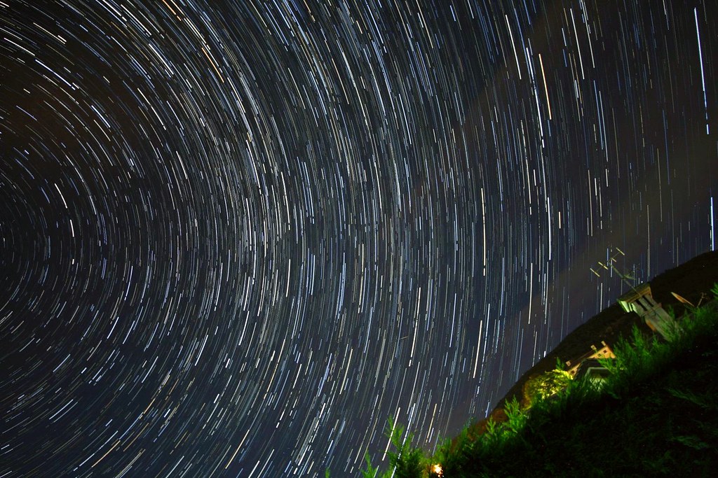 Arcs of star trails over my village.