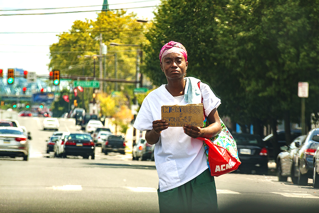 Homeless woman begging on 8-20-16--Girard Avenue