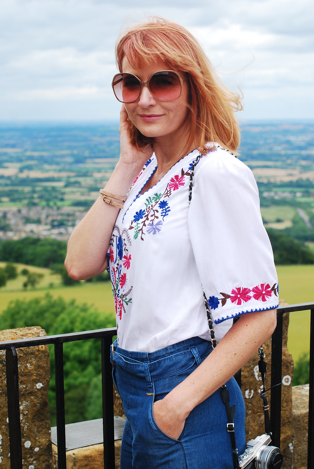 Embroidery and denim: Greek-style embroidered top, wide leg jeans, red lace-up espadrilles | Broadway Tower, The Cotswolds | Not Dressed As Lamb