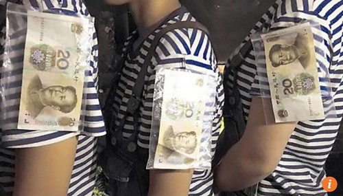 Restaurant staff wearing banknotes