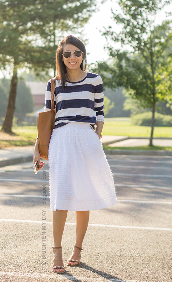 wide navy striped top, white midi skirt with clip dot, cognac brown tote, jeweled block heels