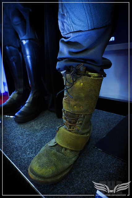 The Establishing Shot: TOM HARDY'S BANE COSTUME FROM THE DARK KNIGHT RISES, BOOT CLOSE UP - PROP STORE ENTERTAINMENT LIVE AUCTION PREVIEW EXHIBITION - ODEON BFI IMAX, LONDON