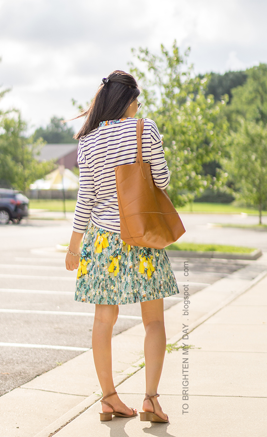 navy striped top over floral dress, cognac brown tote, jeweled sandals, pave chain bracelet